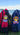 Two backpacks with W.E.Kiwi and K.B.Kiwi mini plushies on a grass with New Zea;and beach background